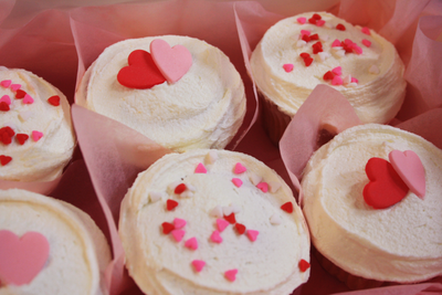 My Little Cupcake Vanilla Vegan Heart Cupcakes hand-iced with white vegan buttercream icing & decorated with adorable edible pink and red vegan love hearts